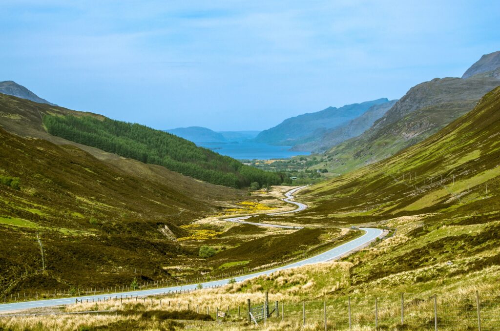 Winding road through a Scottish glen.