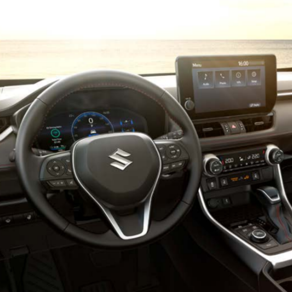 Image of Across interior including steering wheel and sound system