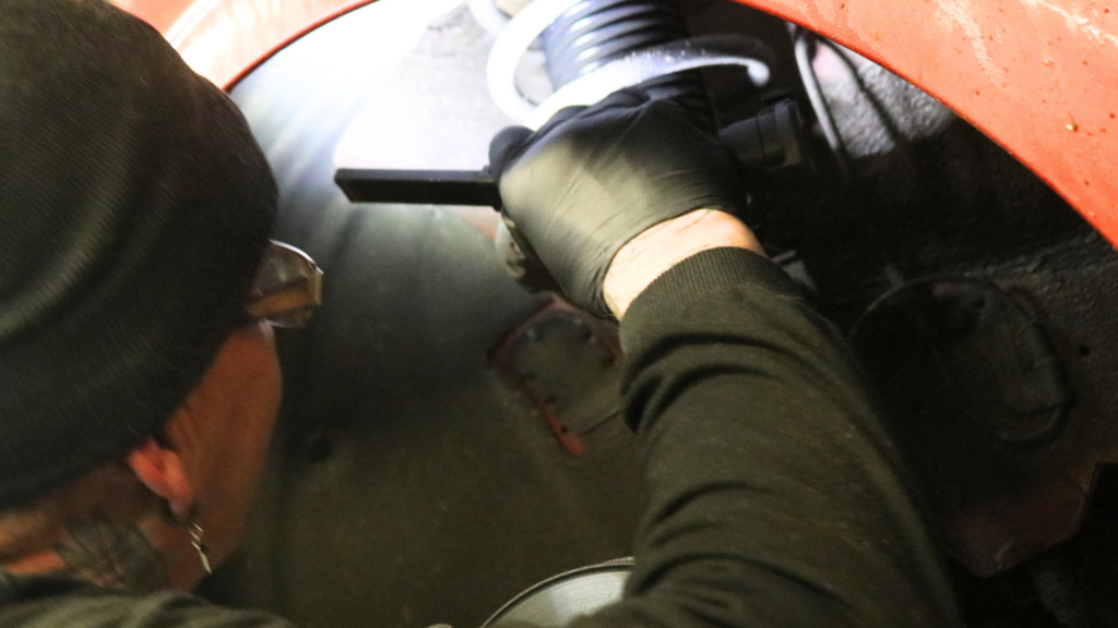 Image of a Dicksons technician working on car repairs.