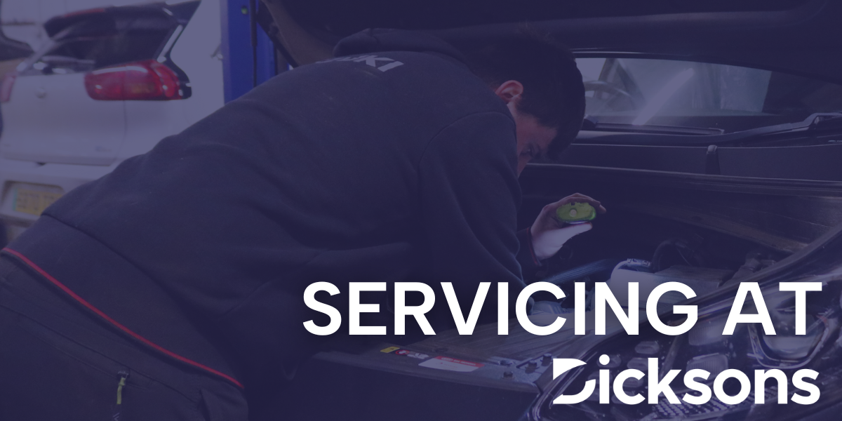 Image of someone servicing car