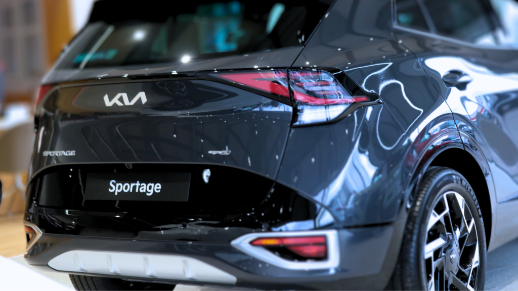 Image of Kia Sportage in showroom from back.